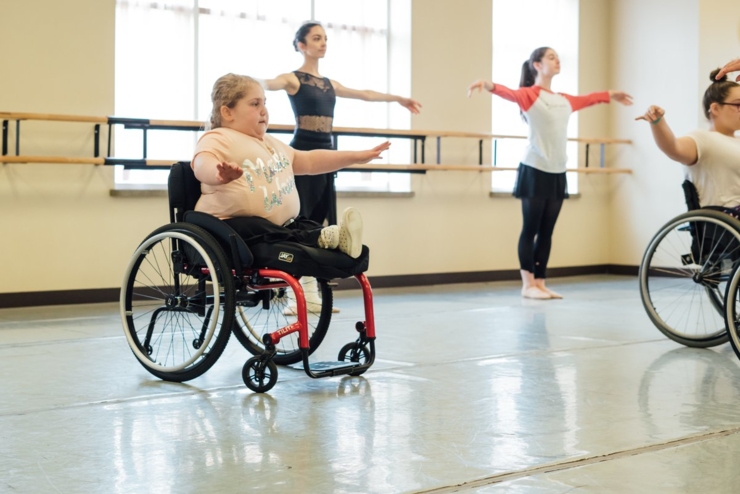 Girl in wheel chair performing Ballet